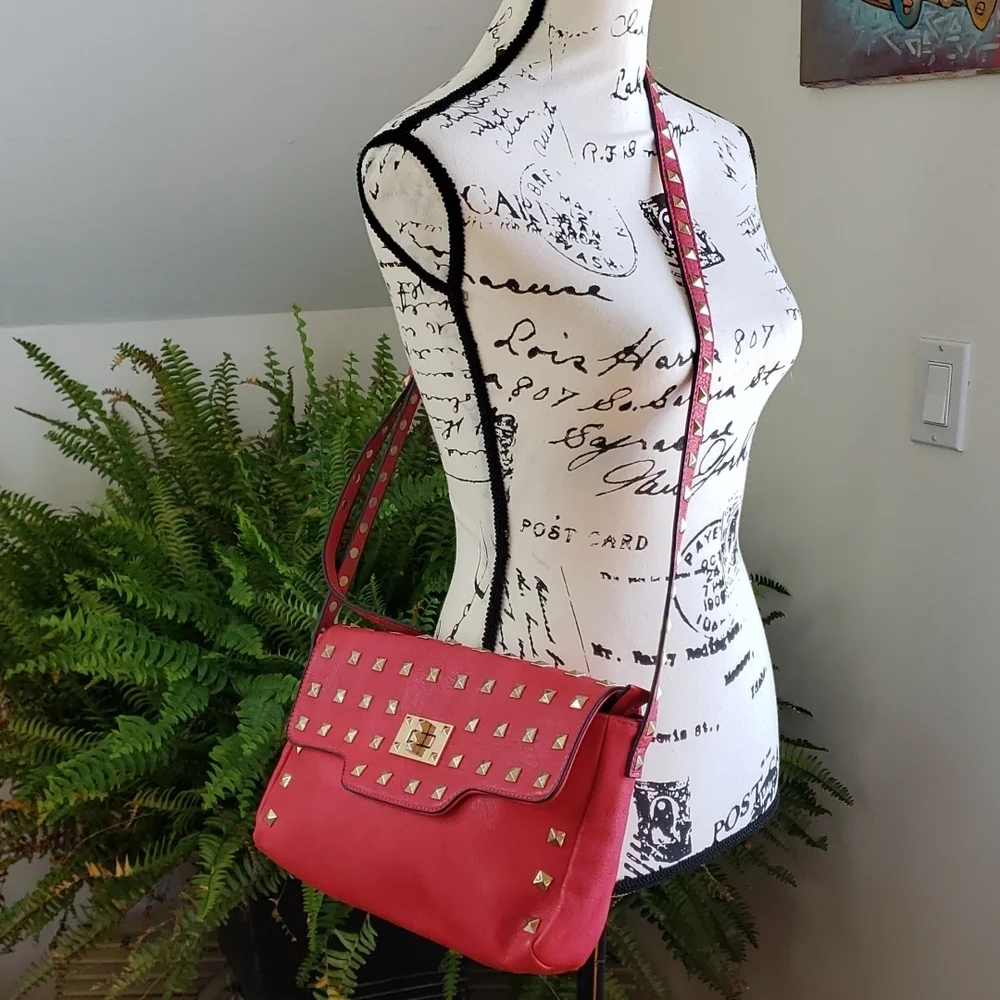 RED studded-embellished lipstick red vegan leather shoulder bag